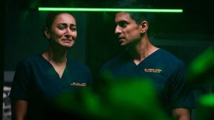 108 Base Hospital URI Week 9 Review: Gashmeer Mahajani And Erica Fernandes Turn The Lens On Grief And Looming Danger Gashmeer Mahajani and Erica Fernandes in an emotional scene from 108 Base Hospital URI Week 9