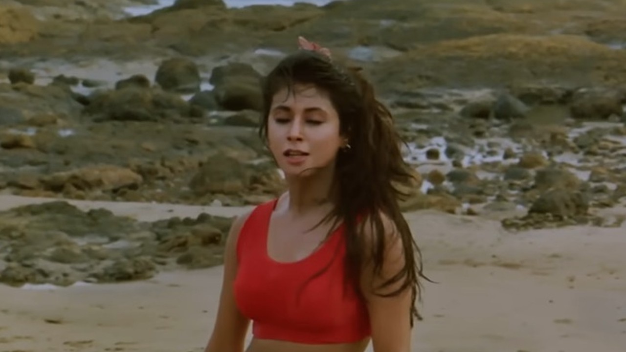 A young Urmila Matondkar performing an intense solo dance sequence from the classic Bollywood musical film Rangeela.