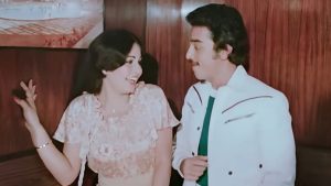Kamal Haasan and Rati Agnihotri smiling together in a scene from the iconic lift song Mere Jeevan Saathi from the 1981 film Ek Duuje Ke Liye