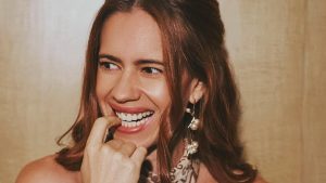 Actress Kalki Koechlin smiling warmly showcasing her natural laugh lines.