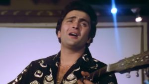 Rishi Kapoor as Monty playing electric guitar in Karz 1980