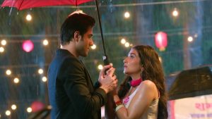 Aditi Dev Sharma and Daksh Puri share a cozy romantic moment under a bright red umbrella in the rain during Shayad Yahi Hai Pyaar Week 2