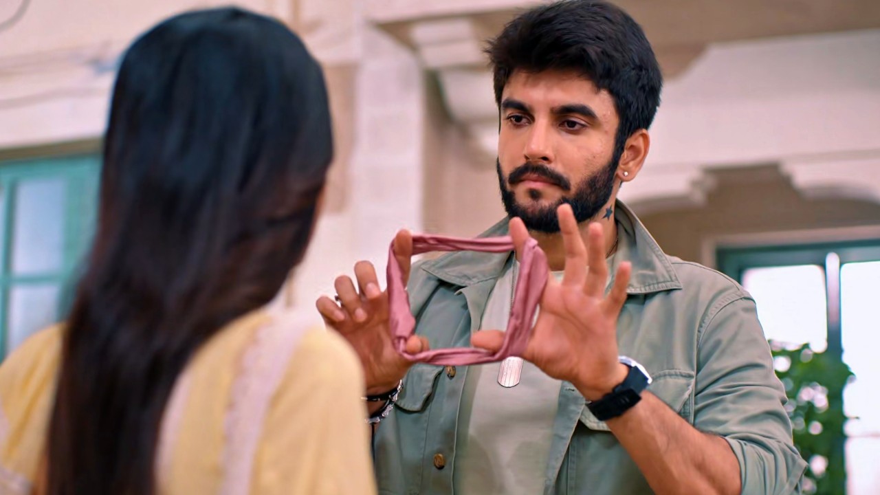Jeet (Ishhan Dhawan) carefully wiping dirt off Saumya's (Debchandrima Singha Roy) dropped scrunchie before sliding it back onto her wrist in Star Plus show Yeh Fitoor Tera.